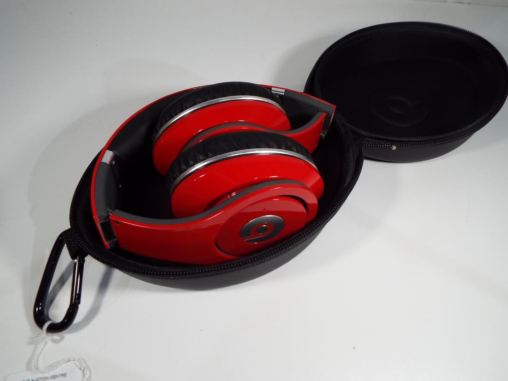 Beats by Dr. Dre - a pair of headphones in soft case.