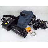 Camera equipment - a Minolta 5000AF camera with carry case and accessories,