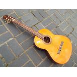 A 6 string Yamaha acoustic guitar, model number G - 85A with original cardboard protective box.