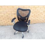 A good quality black and silver office chair on castors