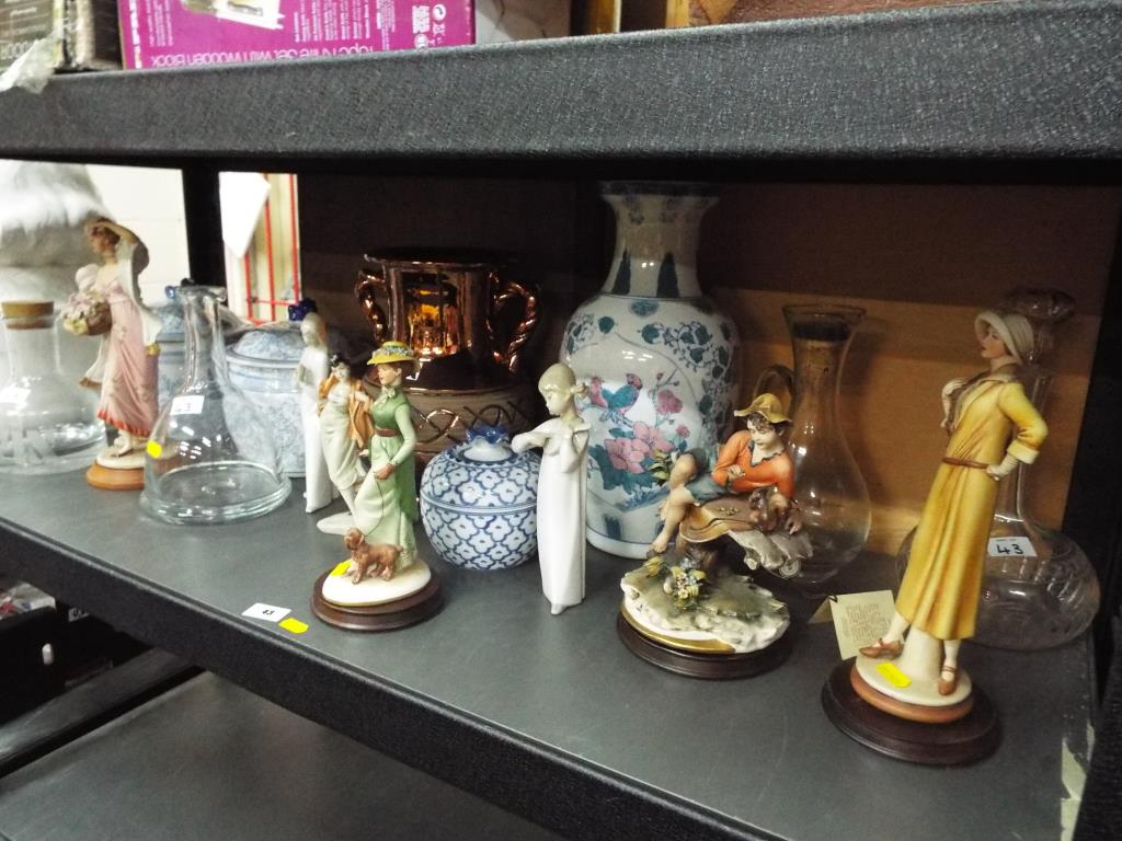 A good collection of glassware and ceramics to include decanters, Capodimonte ceramic figurines,