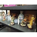 A good collection of glassware and ceramics to include decanters, Capodimonte ceramic figurines,