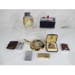 A collection of vintage cigarette lighters and table lighters