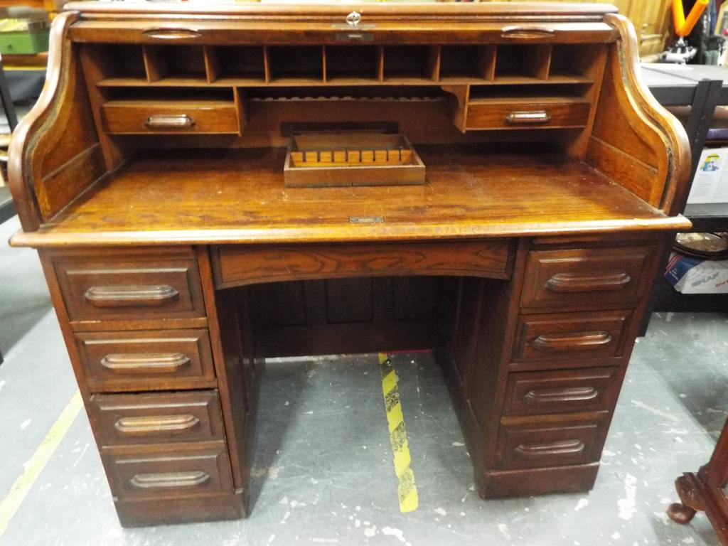 A good quality oak roll-top desk,