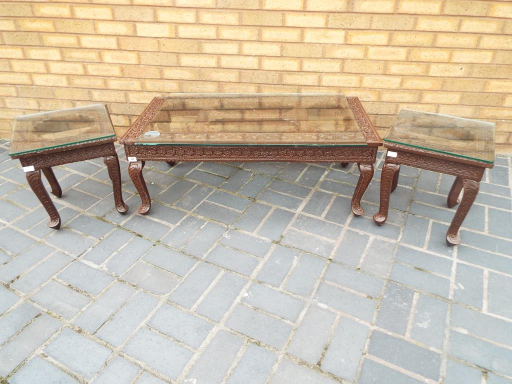 An Indian carved teakwood coffee table and two matched side tables, - Image 2 of 2