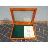 A glass fronted display cabinet - included in the lot is a hallmarking board,