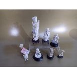 Asian art - a collection of eight carved bone figures,