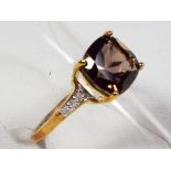 A lady's 9 carat gold diamond set smoky quartz ring, size L, approx. weight 2.