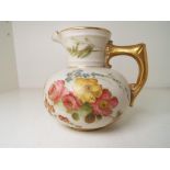 Royal Worcester - an ivory and gilt cream jug of baluster form,