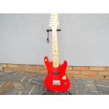 A Johnny Brook beginners electric guitar in red