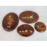 Four hardwood inlaid with ivory Indian wooden wall plaques,