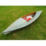 A vintage canoe 332 cm (length) x 82 cm (width) with two paddles and a life jacket