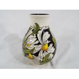 Moorcroft - a Moorcroft vase decorated in the Pheobe pattern, approximately 18 cm (h).