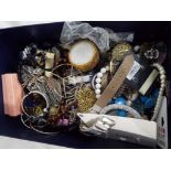 A box containing unsorted costume jewellery,