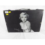 A good quality suitcase printed with a picture of Marilyn Monroe,