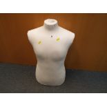 A mannequin in the form of a male torso