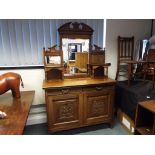 A mahogany carved front Victorian two do