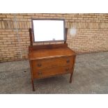 An oak mid century dressing table, 140 x