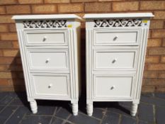 A matching pair of bedside cabinets