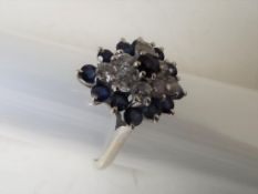 A lady's 14K white gold cluster ring set with diamonds and sapphires, size P, approx weight 3.