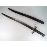 A French model 1842 yataghan sword bayonet with leather grip and leather scabbard with metal mounts