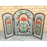 A three panel stained glass screen approximately 71 cm x 104 cm