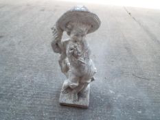 Garden ornament - a stoneware statue depicting a child,