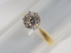 A lady's hallmarked 18 carat yellow gold diamond solitaire, diamond weight .