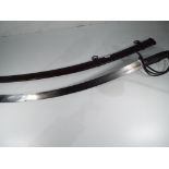 An 1874 pattern heavy cavalry sabre in metal sheath, blade length 81 cm, blade width 3 cm,