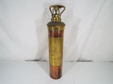 A copper and brass fire extinguisher with embossed brass plate marked Nuswift Baxendale & Co Ltd,