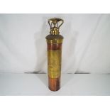 A copper and brass fire extinguisher with embossed brass plate marked Nuswift Baxendale & Co Ltd,