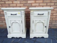 A pair of bedside cabinets,