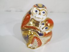 Crown Derby - a Crown Derby paperweight in the form of mother and child monkeys bearing it's gold