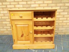 A good quality pine wine cupboard / rack,