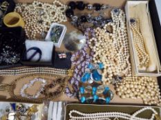 A good mixed lot of predominantly costume jewellery and evening wear to include pearls,