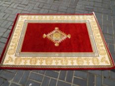 A good quality floor rug by Mastercraft Rugs in red and cream,