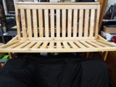 A good quality pine framed double futon approximate height 86 cm x 142 cm x 117 cm