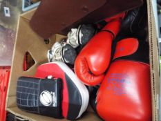 A good mixed lot to include SK Sport boxing gloves, Olympus Sport sparring pad,