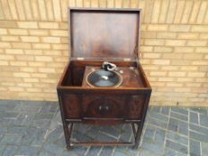 The Dulceola floor standing gramophone with winding arm,