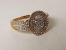 A lady's 9 carat 50 point ½ carat baguette and round diamond ring, approx. 3.