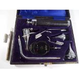 A Gowlland Ophthalmoscope diagnostic set in a lined presentation case also included in the lot is a