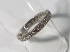 A lady's platinum full eternity ring, diamond set, each diamond 0.