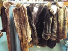 Three lady's fur coats, one dark brown approximate length 100 cm,