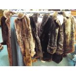 Three lady's fur coats, one dark brown approximate length 100 cm,