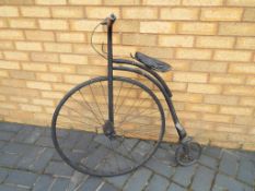 A child's Penny Farthing style bicycle,