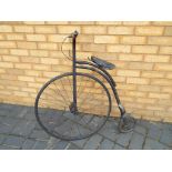 A child's Penny Farthing style bicycle,