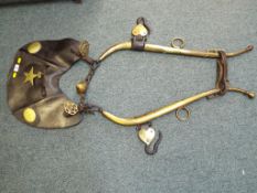 An antique super-quality brass and leather horse tack bearing stamped solid brass patent double