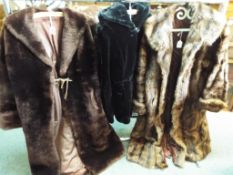Three fur coats, one in brown approximate length 115 cm (l),