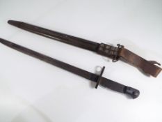 A World War One (WW1) 1917 dated US Winchester Bayonet For P 14 Rifles and Scabbard. A U.S.