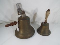 A large wall mounted brass bell approx 9.